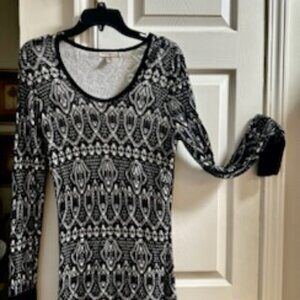 Long sleeved black & white sweater with a lace-like overlay